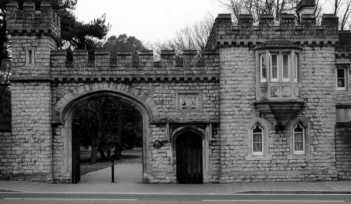 Old blak and white photo of the West Lodge and Gate